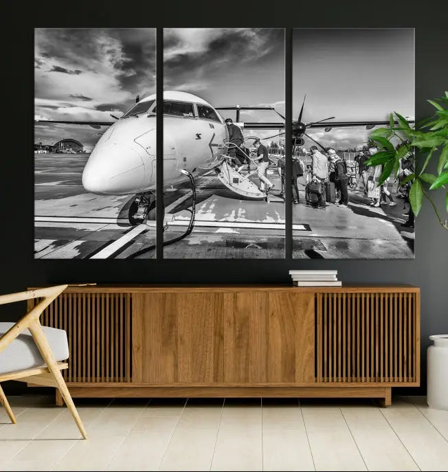 Introducing the Black and White Narrow Body Aircraft Wall Art Canvas Print: This striking three-panel canvas features a timeless black-and-white depiction of people boarding a propeller airplane. Printed on museum-quality canvas, each piece is UV-protected to maintain its vibrancy. These prints are ready to hang, making it easy to display them with ease.