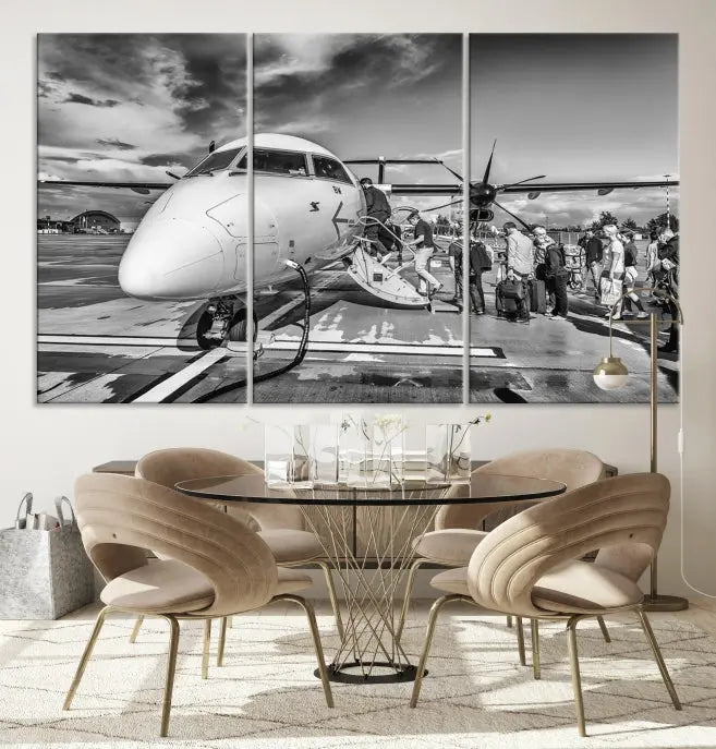 Introducing the Black and White Narrow Body Aircraft Wall Art Canvas Print: This striking three-panel canvas features a timeless black-and-white depiction of people boarding a propeller airplane. Printed on museum-quality canvas, each piece is UV-protected to maintain its vibrancy. These prints are ready to hang, making it easy to display them with ease.