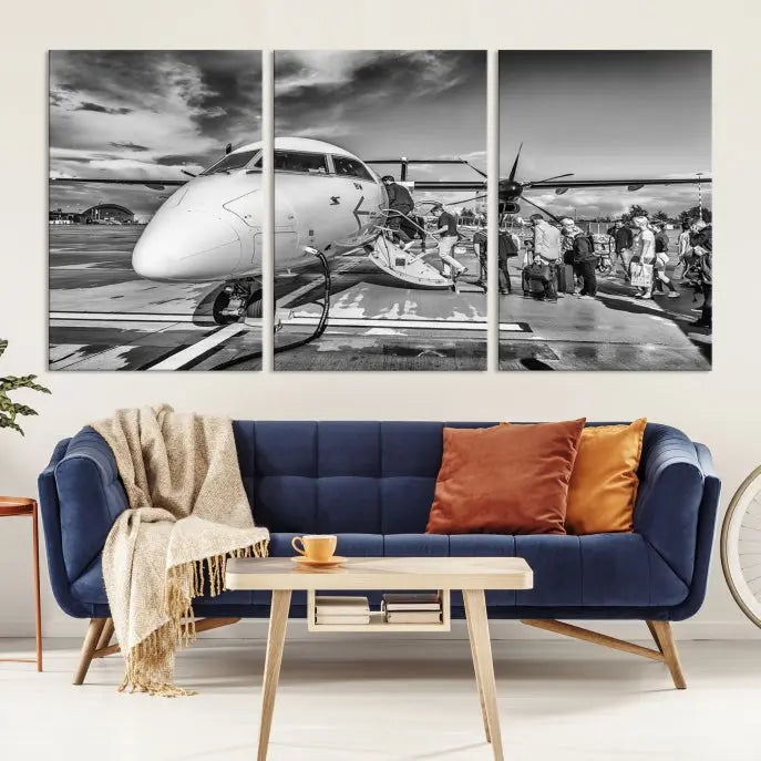 Introducing the Black and White Narrow Body Aircraft Wall Art Canvas Print: This striking three-panel canvas features a timeless black-and-white depiction of people boarding a propeller airplane. Printed on museum-quality canvas, each piece is UV-protected to maintain its vibrancy. These prints are ready to hang, making it easy to display them with ease.