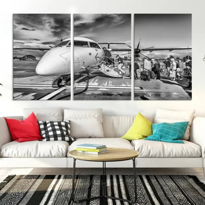 Introducing the Black and White Narrow Body Aircraft Wall Art Canvas Print: This striking three-panel canvas features a timeless black-and-white depiction of people boarding a propeller airplane. Printed on museum-quality canvas, each piece is UV-protected to maintain its vibrancy. These prints are ready to hang, making it easy to display them with ease.