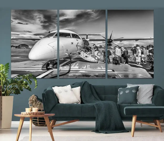 Introducing the Black and White Narrow Body Aircraft Wall Art Canvas Print: This striking three-panel canvas features a timeless black-and-white depiction of people boarding a propeller airplane. Printed on museum-quality canvas, each piece is UV-protected to maintain its vibrancy. These prints are ready to hang, making it easy to display them with ease.