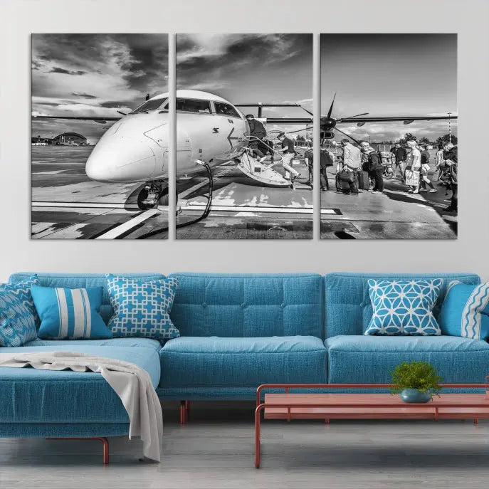 Introducing the Black and White Narrow Body Aircraft Wall Art Canvas Print: This striking three-panel canvas features a timeless black-and-white depiction of people boarding a propeller airplane. Printed on museum-quality canvas, each piece is UV-protected to maintain its vibrancy. These prints are ready to hang, making it easy to display them with ease.