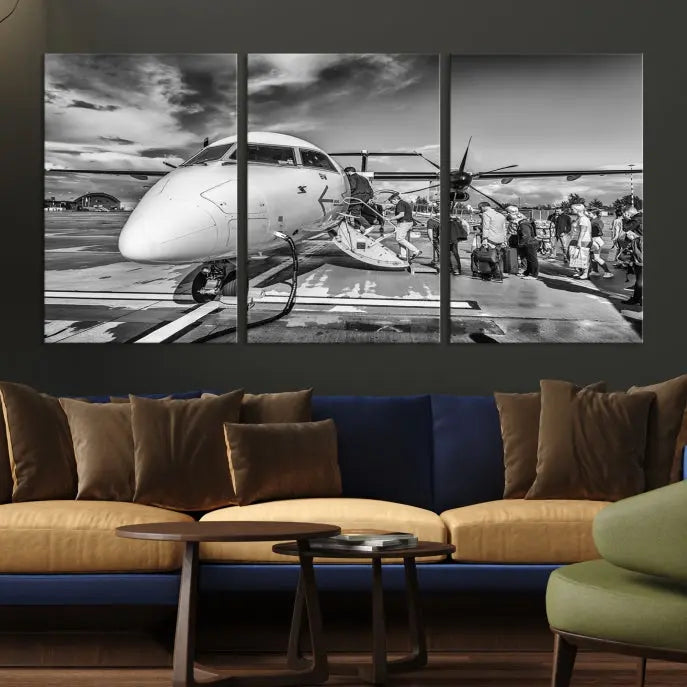 Introducing the Black and White Narrow Body Aircraft Wall Art Canvas Print: This striking three-panel canvas features a timeless black-and-white depiction of people boarding a propeller airplane. Printed on museum-quality canvas, each piece is UV-protected to maintain its vibrancy. These prints are ready to hang, making it easy to display them with ease.