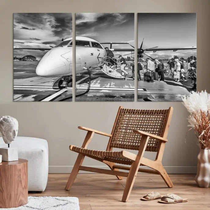 Introducing the Black and White Narrow Body Aircraft Wall Art Canvas Print: This striking three-panel canvas features a timeless black-and-white depiction of people boarding a propeller airplane. Printed on museum-quality canvas, each piece is UV-protected to maintain its vibrancy. These prints are ready to hang, making it easy to display them with ease.