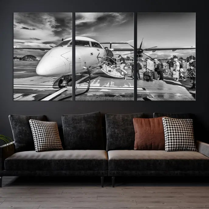 Introducing the Black and White Narrow Body Aircraft Wall Art Canvas Print: This striking three-panel canvas features a timeless black-and-white depiction of people boarding a propeller airplane. Printed on museum-quality canvas, each piece is UV-protected to maintain its vibrancy. These prints are ready to hang, making it easy to display them with ease.