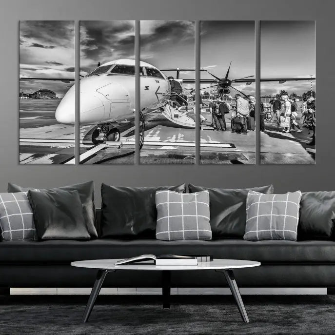 Introducing the Black and White Narrow Body Aircraft Wall Art Canvas Print: This striking three-panel canvas features a timeless black-and-white depiction of people boarding a propeller airplane. Printed on museum-quality canvas, each piece is UV-protected to maintain its vibrancy. These prints are ready to hang, making it easy to display them with ease.