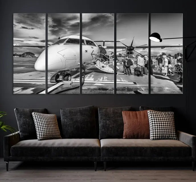 Introducing the Black and White Narrow Body Aircraft Wall Art Canvas Print: This striking three-panel canvas features a timeless black-and-white depiction of people boarding a propeller airplane. Printed on museum-quality canvas, each piece is UV-protected to maintain its vibrancy. These prints are ready to hang, making it easy to display them with ease.