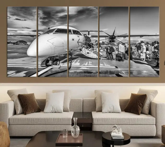 Introducing the Black and White Narrow Body Aircraft Wall Art Canvas Print: This striking three-panel canvas features a timeless black-and-white depiction of people boarding a propeller airplane. Printed on museum-quality canvas, each piece is UV-protected to maintain its vibrancy. These prints are ready to hang, making it easy to display them with ease.