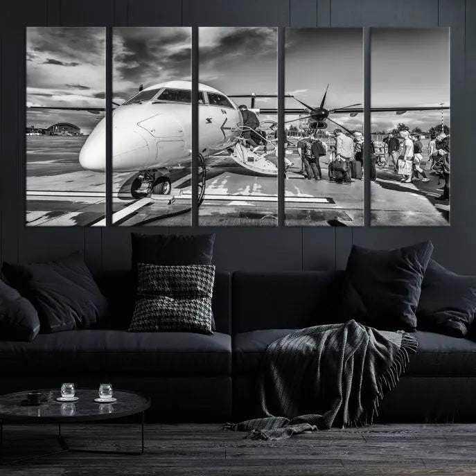 Introducing the Black and White Narrow Body Aircraft Wall Art Canvas Print: This striking three-panel canvas features a timeless black-and-white depiction of people boarding a propeller airplane. Printed on museum-quality canvas, each piece is UV-protected to maintain its vibrancy. These prints are ready to hang, making it easy to display them with ease.