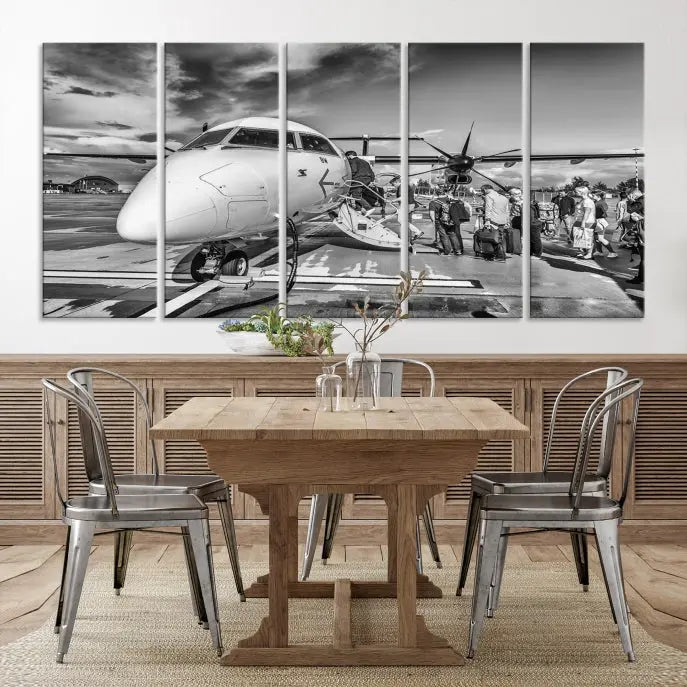 Introducing the Black and White Narrow Body Aircraft Wall Art Canvas Print: This striking three-panel canvas features a timeless black-and-white depiction of people boarding a propeller airplane. Printed on museum-quality canvas, each piece is UV-protected to maintain its vibrancy. These prints are ready to hang, making it easy to display them with ease.