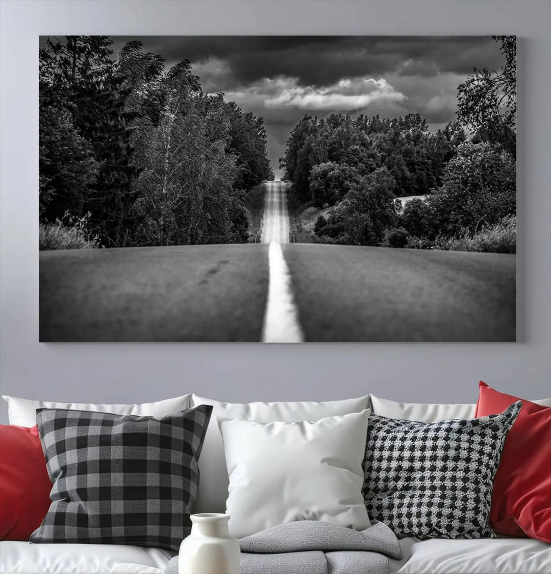 The Black and White Road in Forest Wall Art Canvas Print captures a rural road disappearing into the distance under cloudy skies, presented as a triptych. These gallery-wrapped canvases boast museum-quality construction and a UV-protective coating.