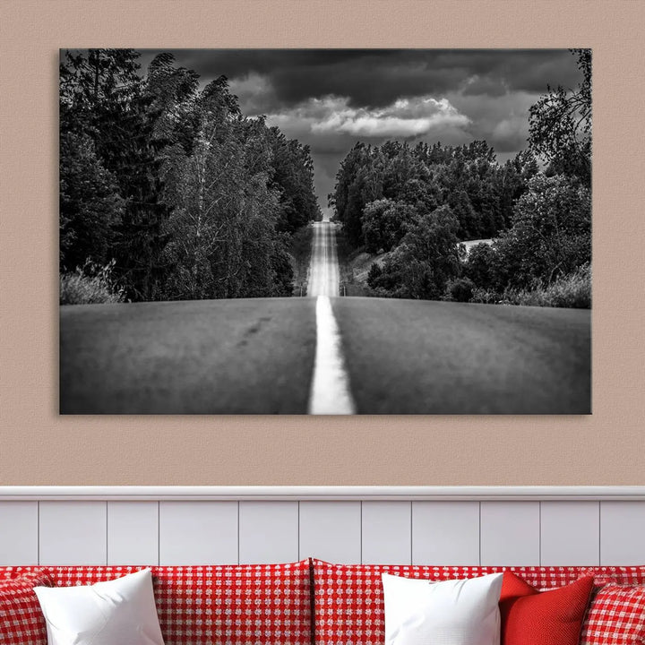 The Black and White Road in Forest Wall Art Canvas Print captures a rural road disappearing into the distance under cloudy skies, presented as a triptych. These gallery-wrapped canvases boast museum-quality construction and a UV-protective coating.