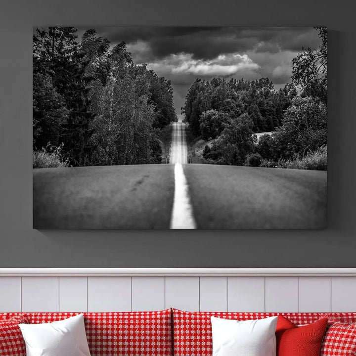 The Black and White Road in Forest Wall Art Canvas Print captures a rural road disappearing into the distance under cloudy skies, presented as a triptych. These gallery-wrapped canvases boast museum-quality construction and a UV-protective coating.