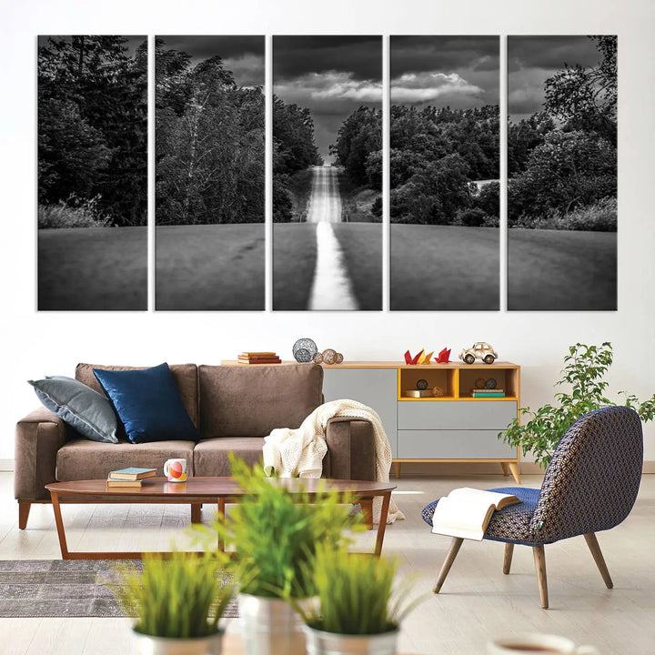 The Black and White Road in Forest Wall Art Canvas Print captures a rural road disappearing into the distance under cloudy skies, presented as a triptych. These gallery-wrapped canvases boast museum-quality construction and a UV-protective coating.