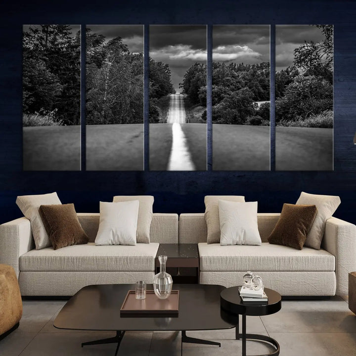 The Black and White Road in Forest Wall Art Canvas Print captures a rural road disappearing into the distance under cloudy skies, presented as a triptych. These gallery-wrapped canvases boast museum-quality construction and a UV-protective coating.