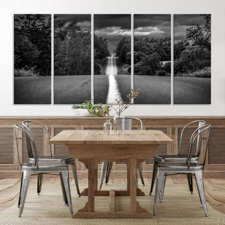 The Black and White Road in Forest Wall Art Canvas Print captures a rural road disappearing into the distance under cloudy skies, presented as a triptych. These gallery-wrapped canvases boast museum-quality construction and a UV-protective coating.