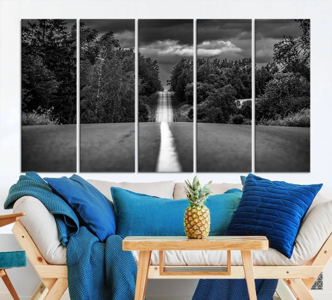 The Black and White Road in Forest Wall Art Canvas Print captures a rural road disappearing into the distance under cloudy skies, presented as a triptych. These gallery-wrapped canvases boast museum-quality construction and a UV-protective coating.