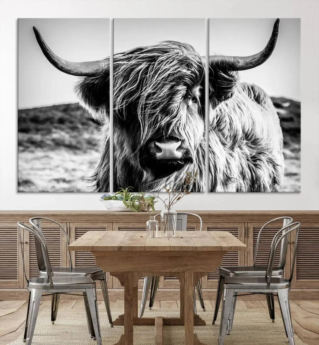 The "Black and White Scottish Cow Canvas Wall Art," a three-panel piece featuring a long-haired cow with large horns, enhances the room with its farmhouse decor charm.