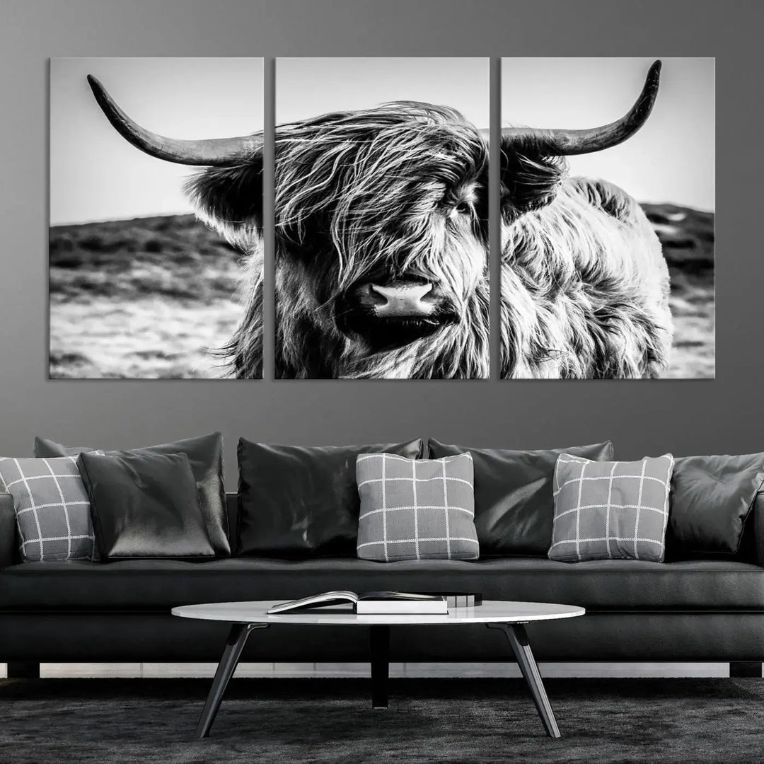 The "Black and White Scottish Cow Canvas Wall Art," a three-panel piece featuring a long-haired cow with large horns, enhances the room with its farmhouse decor charm.