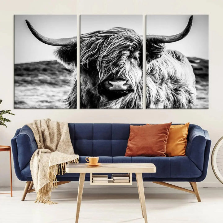 The "Black and White Scottish Cow Canvas Wall Art," a three-panel piece featuring a long-haired cow with large horns, enhances the room with its farmhouse decor charm.