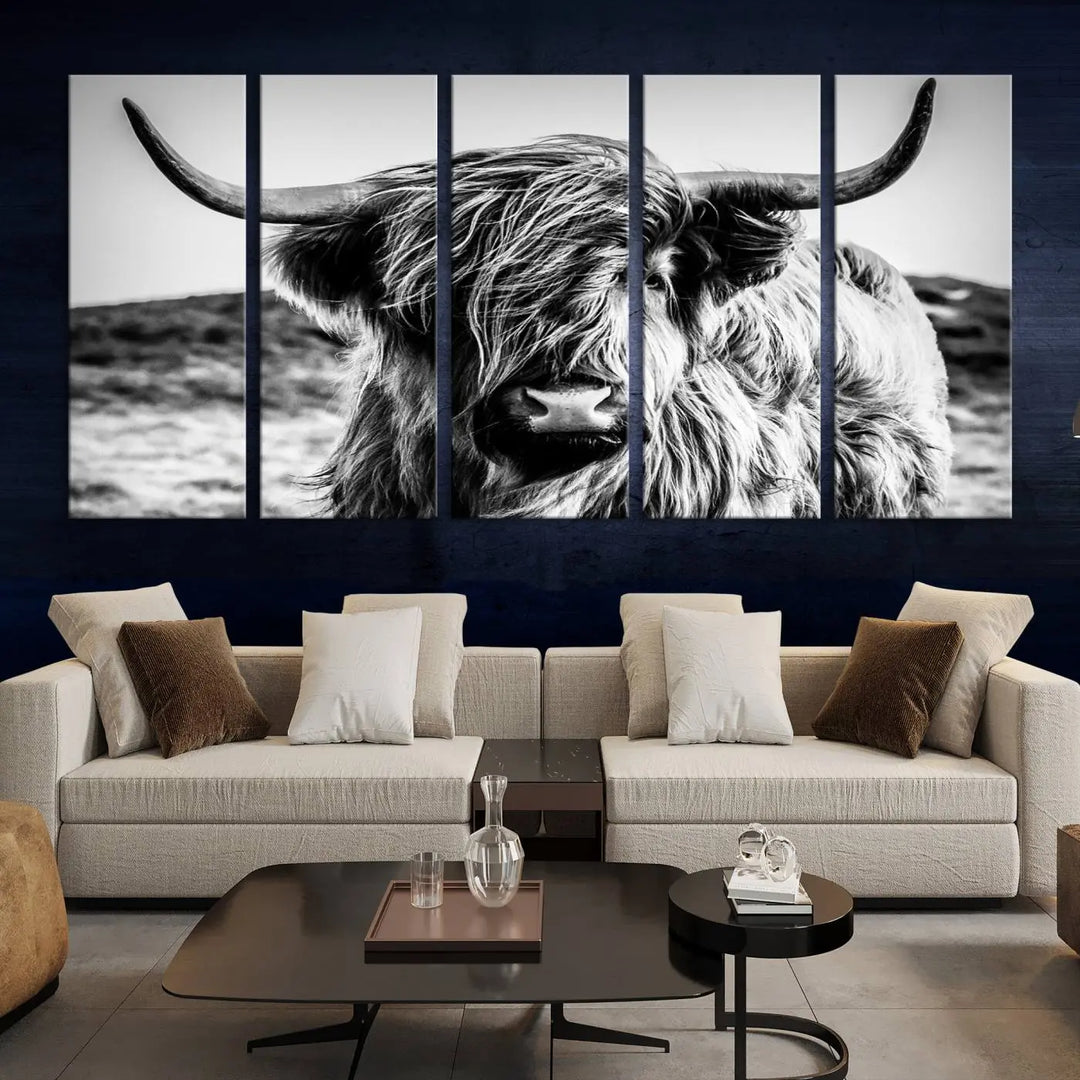 The "Black and White Scottish Cow Canvas Wall Art," a three-panel piece featuring a long-haired cow with large horns, enhances the room with its farmhouse decor charm.