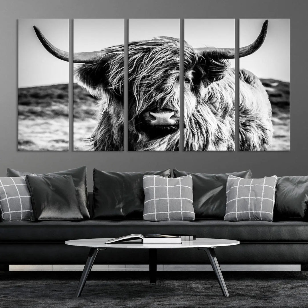 The "Black and White Scottish Cow Canvas Wall Art," a three-panel piece featuring a long-haired cow with large horns, enhances the room with its farmhouse decor charm.