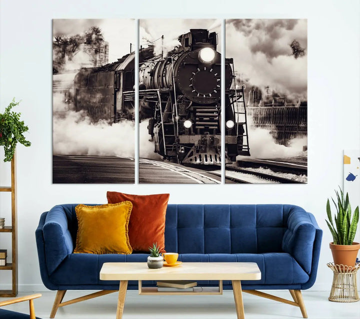 The living room showcases a triptych of the Black and White Steam Locomotive Canvas Wall Art Print.