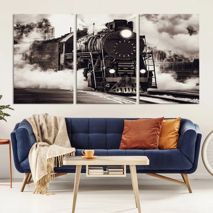 The living room showcases a triptych of the Black and White Steam Locomotive Canvas Wall Art Print.