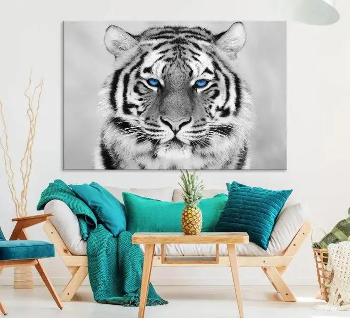 A piece from the Black and White Tiger Wall Art Animal Canvas Print collection, showcasing a white tiger with blue eyes on premium canvas, is displayed.