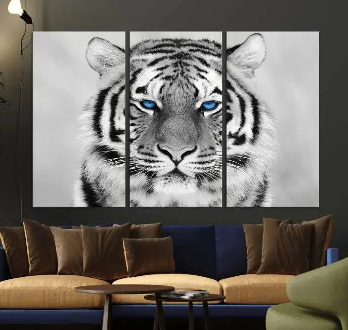 A piece from the Black and White Tiger Wall Art Animal Canvas Print collection, showcasing a white tiger with blue eyes on premium canvas, is displayed.