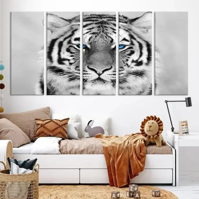 A piece from the Black and White Tiger Wall Art Animal Canvas Print collection, showcasing a white tiger with blue eyes on premium canvas, is displayed.