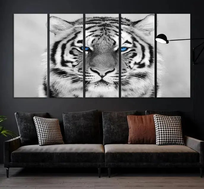 A piece from the Black and White Tiger Wall Art Animal Canvas Print collection, showcasing a white tiger with blue eyes on premium canvas, is displayed.