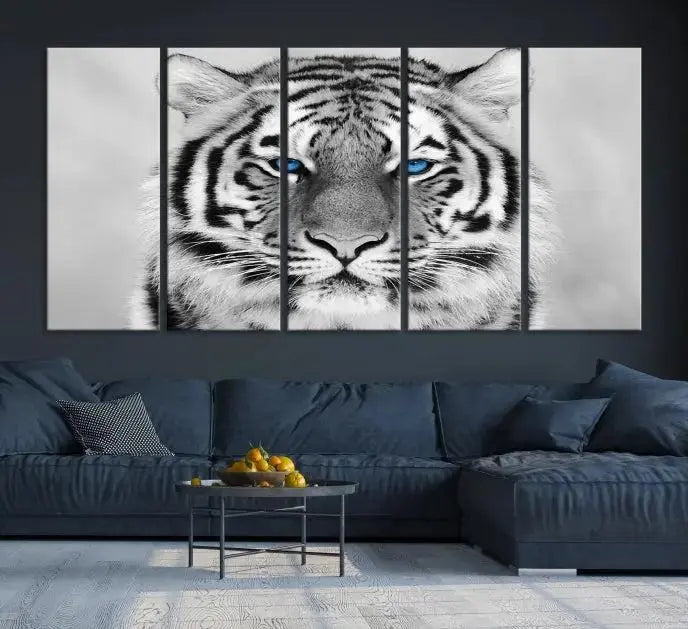 A piece from the Black and White Tiger Wall Art Animal Canvas Print collection, showcasing a white tiger with blue eyes on premium canvas, is displayed.