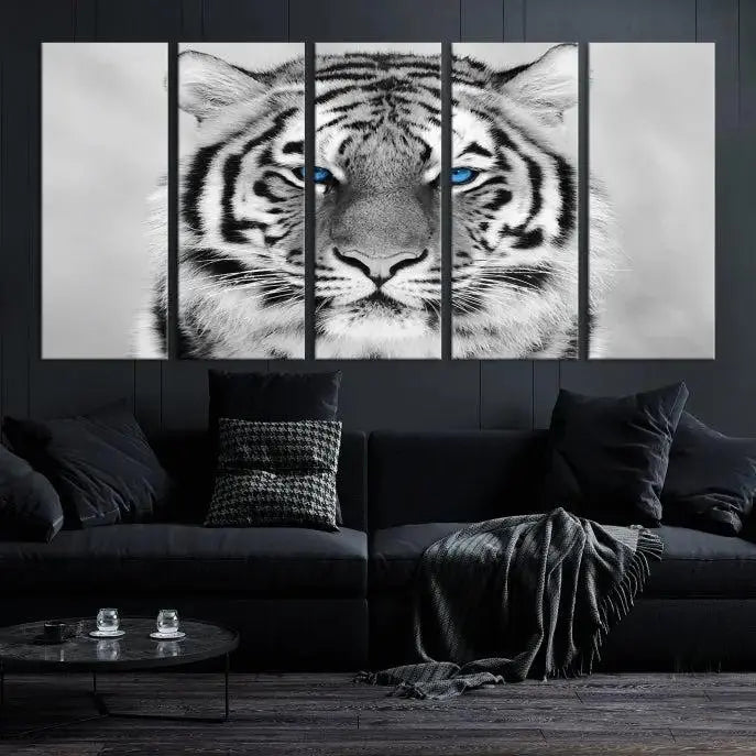 A piece from the Black and White Tiger Wall Art Animal Canvas Print collection, showcasing a white tiger with blue eyes on premium canvas, is displayed.