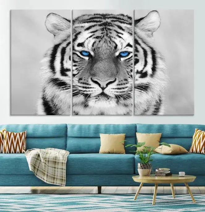 A piece from the Black and White Tiger Wall Art Animal Canvas Print collection, showcasing a white tiger with blue eyes on premium canvas, is displayed.