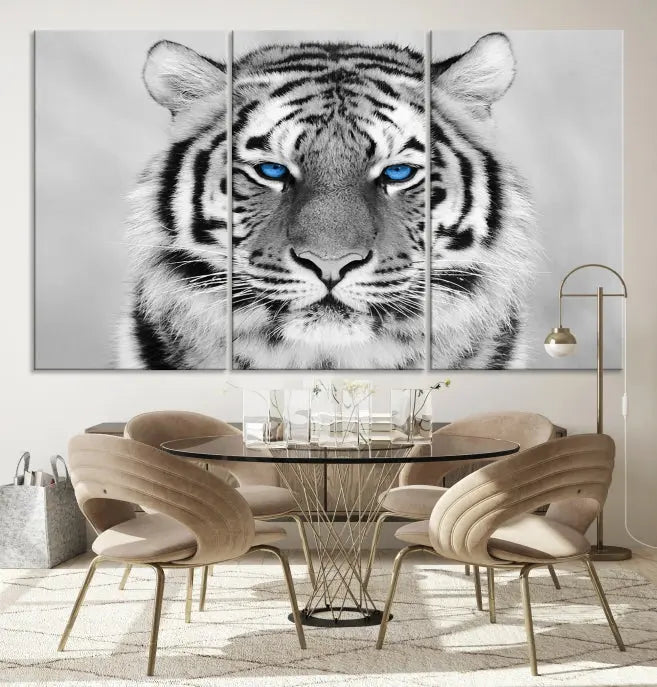 A piece from the Black and White Tiger Wall Art Animal Canvas Print collection, showcasing a white tiger with blue eyes on premium canvas, is displayed.