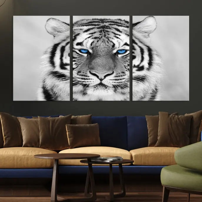 A piece from the Black and White Tiger Wall Art Animal Canvas Print collection, showcasing a white tiger with blue eyes on premium canvas, is displayed.