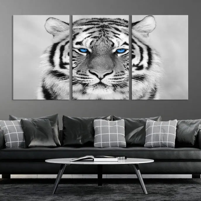 A piece from the Black and White Tiger Wall Art Animal Canvas Print collection, showcasing a white tiger with blue eyes on premium canvas, is displayed.