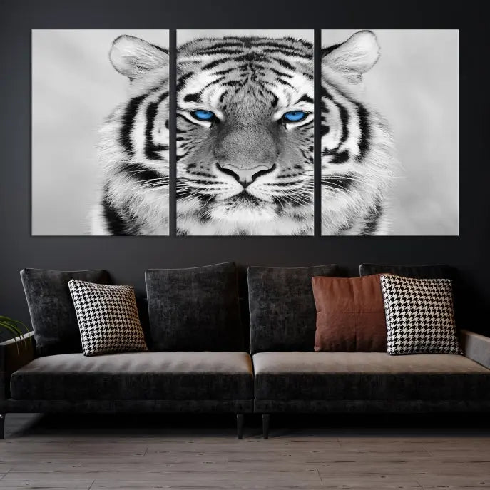 A piece from the Black and White Tiger Wall Art Animal Canvas Print collection, showcasing a white tiger with blue eyes on premium canvas, is displayed.