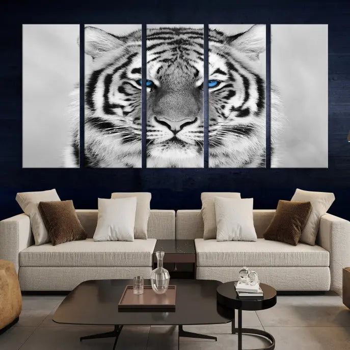 A piece from the Black and White Tiger Wall Art Animal Canvas Print collection, showcasing a white tiger with blue eyes on premium canvas, is displayed.