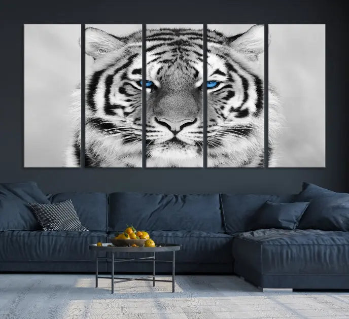 A piece from the Black and White Tiger Wall Art Animal Canvas Print collection, showcasing a white tiger with blue eyes on premium canvas, is displayed.