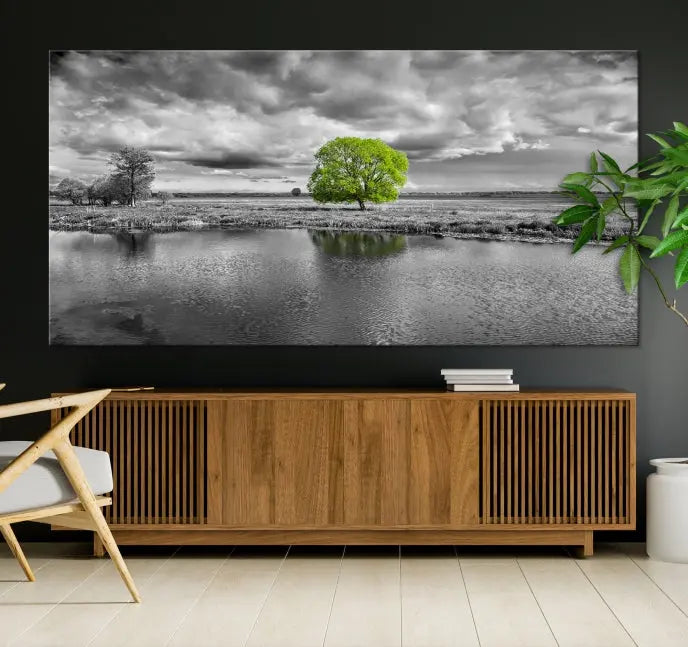 The Black and White Tree Landscape Painting Wall Art Tree Canvas Print is a stunning triptych that features a monochrome landscape punctuated with a single vivid green tree. The pieces are printed on museum-quality canvases, offering both durability and style, and are complemented by a UV-protective coating for added longevity.