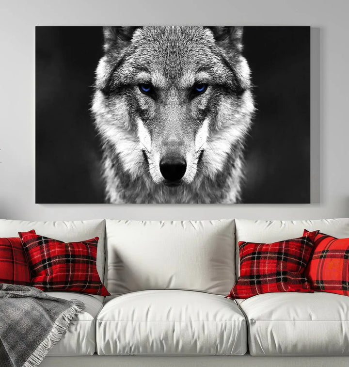 The Black and White Wild Wolf Wall Art Canvas Print, featuring a wolf with striking blue eyes, beautifully enhances any space. As a museum-quality piece with UV-protective coating and ready-to-hang design, it effortlessly brings elegance and convenience to your room.