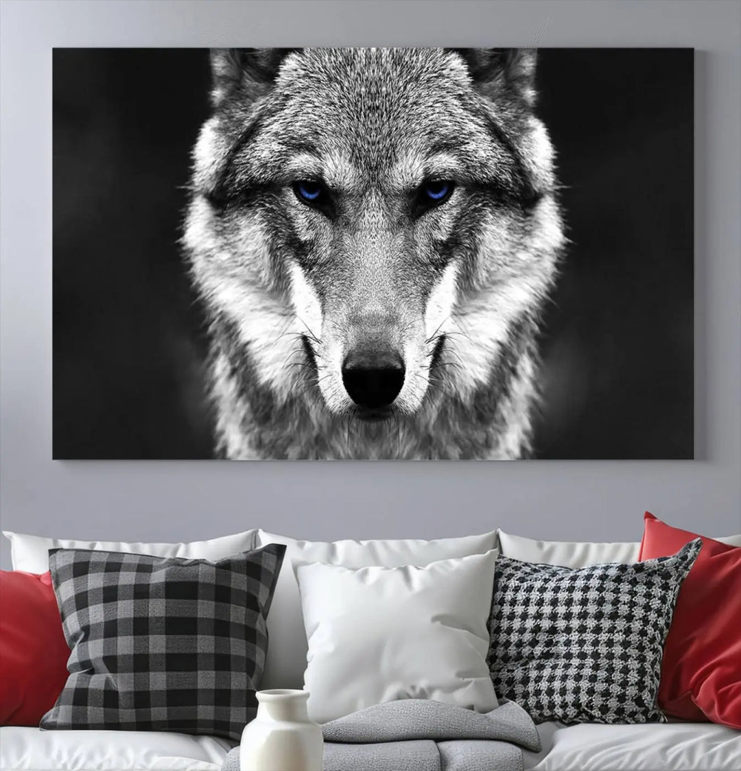 The Black and White Wild Wolf Wall Art Canvas Print, featuring a wolf with striking blue eyes, beautifully enhances any space. As a museum-quality piece with UV-protective coating and ready-to-hang design, it effortlessly brings elegance and convenience to your room.