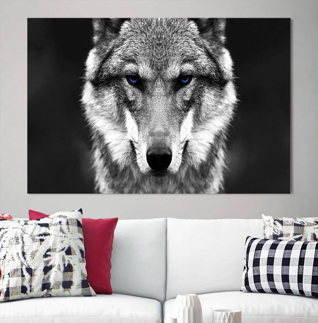 The Black and White Wild Wolf Wall Art Canvas Print, featuring a wolf with striking blue eyes, beautifully enhances any space. As a museum-quality piece with UV-protective coating and ready-to-hang design, it effortlessly brings elegance and convenience to your room.