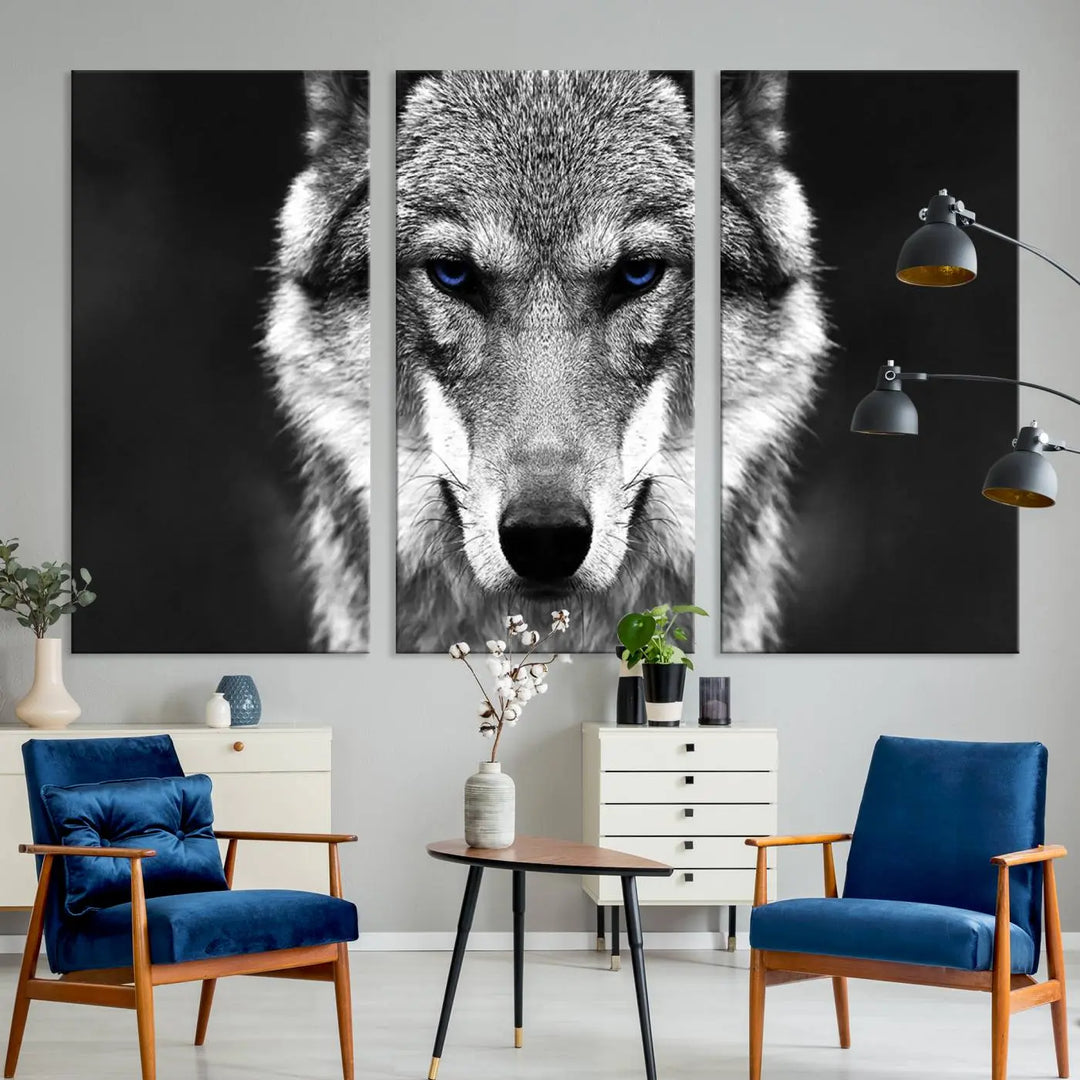 The Black and White Wild Wolf Wall Art Canvas Print, featuring a wolf with striking blue eyes, beautifully enhances any space. As a museum-quality piece with UV-protective coating and ready-to-hang design, it effortlessly brings elegance and convenience to your room.