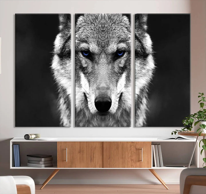 The Black and White Wild Wolf Wall Art Canvas Print, featuring a wolf with striking blue eyes, beautifully enhances any space. As a museum-quality piece with UV-protective coating and ready-to-hang design, it effortlessly brings elegance and convenience to your room.