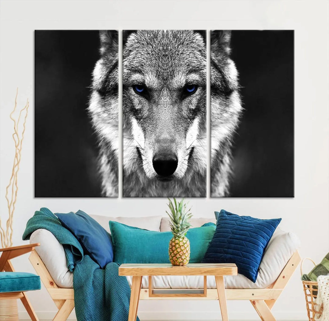 The Black and White Wild Wolf Wall Art Canvas Print, featuring a wolf with striking blue eyes, beautifully enhances any space. As a museum-quality piece with UV-protective coating and ready-to-hang design, it effortlessly brings elegance and convenience to your room.