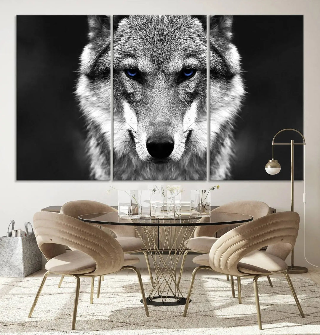 The Black and White Wild Wolf Wall Art Canvas Print, featuring a wolf with striking blue eyes, beautifully enhances any space. As a museum-quality piece with UV-protective coating and ready-to-hang design, it effortlessly brings elegance and convenience to your room.