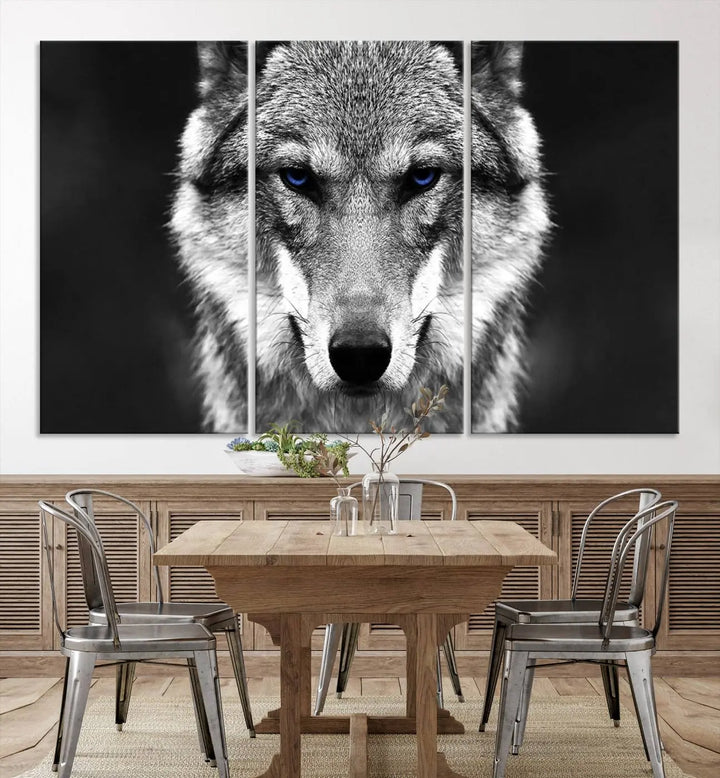 The Black and White Wild Wolf Wall Art Canvas Print, featuring a wolf with striking blue eyes, beautifully enhances any space. As a museum-quality piece with UV-protective coating and ready-to-hang design, it effortlessly brings elegance and convenience to your room.